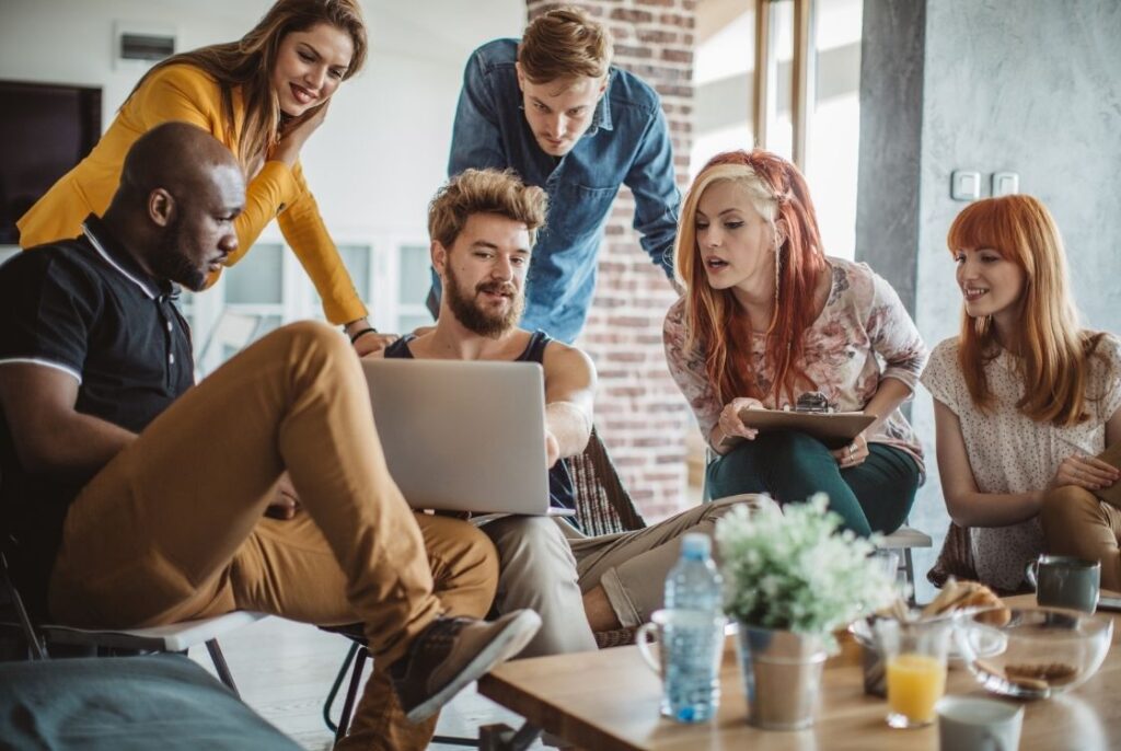 Group of people looking onto a computer screen
