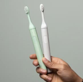 the SURI toothbrush comes in two colors; white and seafoam