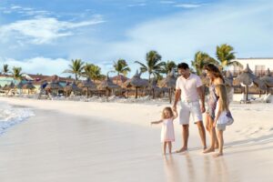 family of 4 on a tropical beach